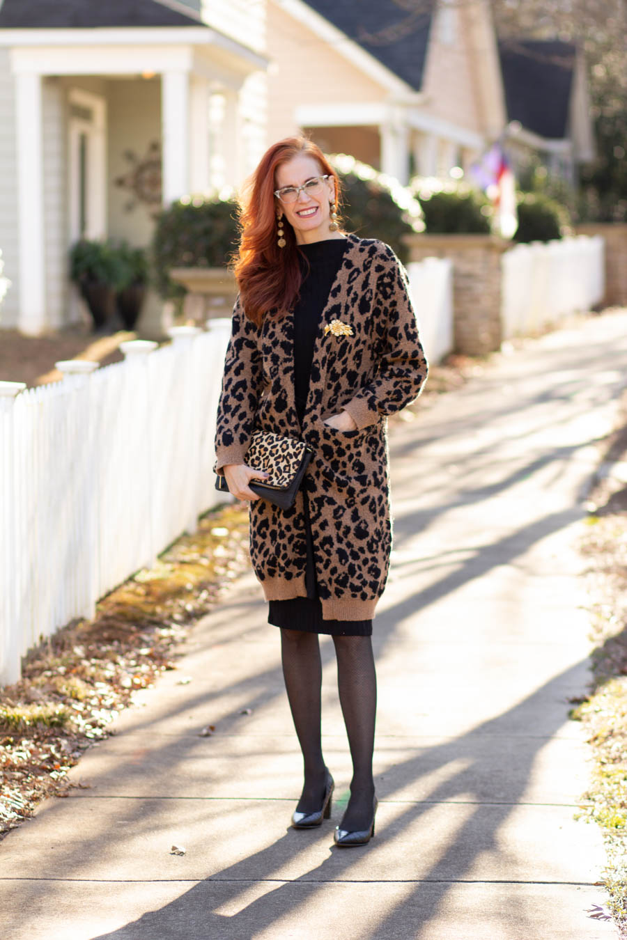Leopard cardigan over black dress