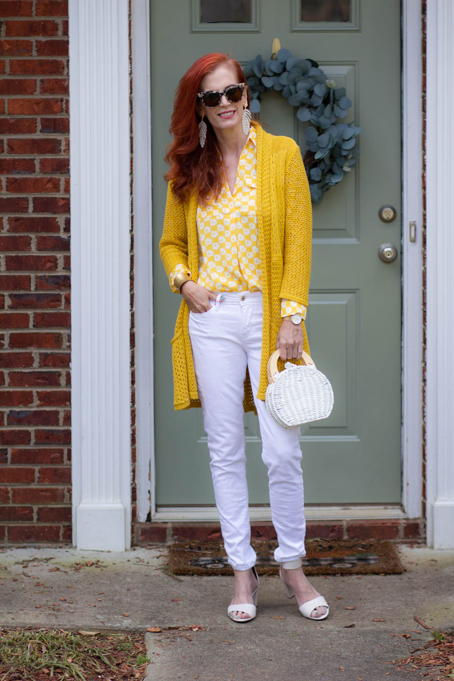 yellow and white blouse with white jeans